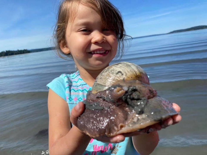 Little Girl With a Moon Snail at Delano Bay